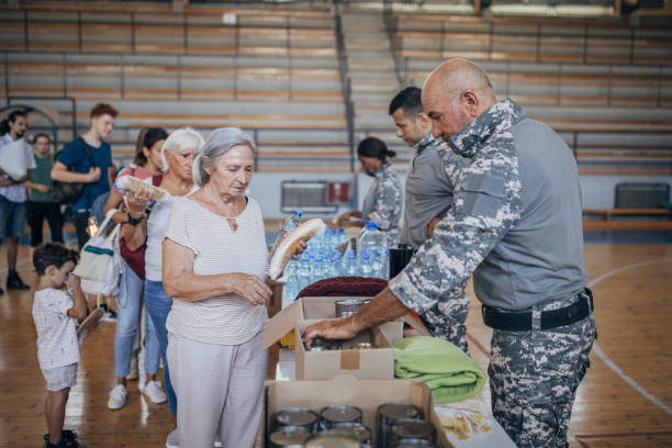istock Civilians receiving donations after natural disaster 1417749831