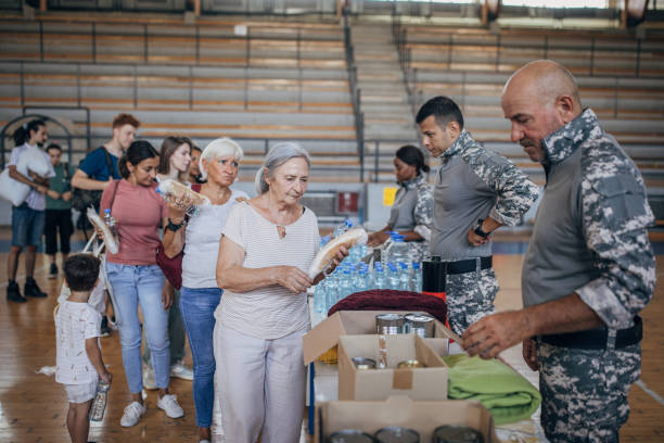 istock Civilians receiving donations after natural disaster 1417749856