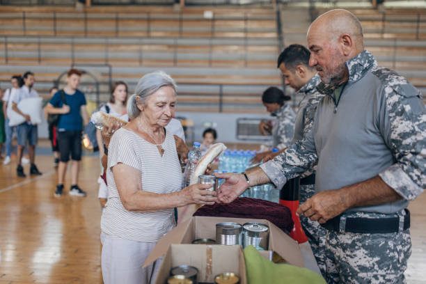 istock Civilians receiving donations after natural disaster 1417749883