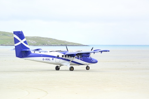 A Loganair Viking DHC-6-400 Twin Otter taxiing before take-off at Barra Airport(Scotland,UK),  believed to be the only airport in the world where scheduled flights use a tidal beach as the runway.