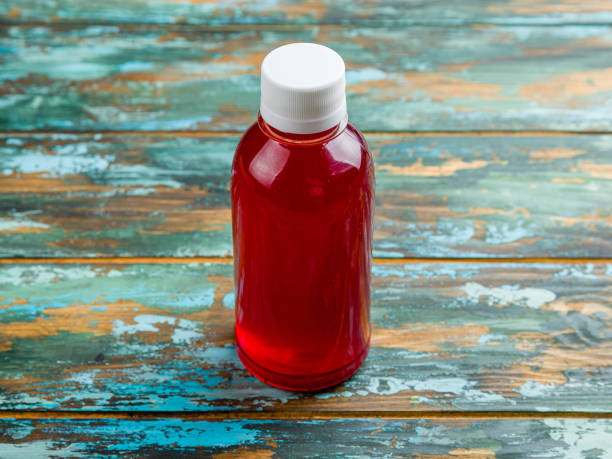 istock lingonberry juice in a plastic bottle on wooden table 1417752655