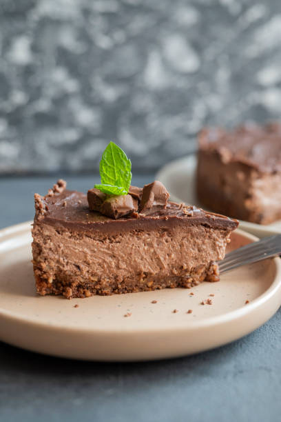 istock delicious sweet chocolate cake cheesecake in a restaurant mint leaf on a plate 1417753600