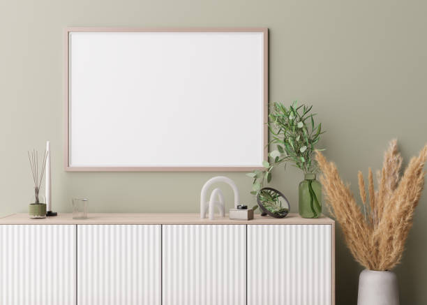 istock Empty horizontal picture frame on light green wall in modern living room. Mock up interior in contemporary, boho style. Copy space for your picture, poster. Vase with pampas grass, console. 3D render. 1417754571