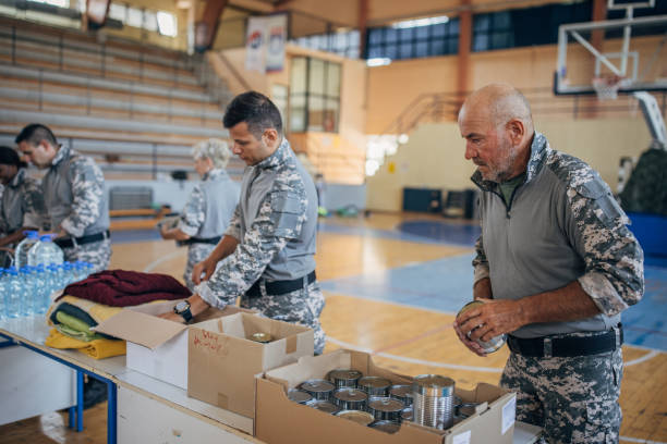 istock Soldiers preparing donations for civilians 1417756283