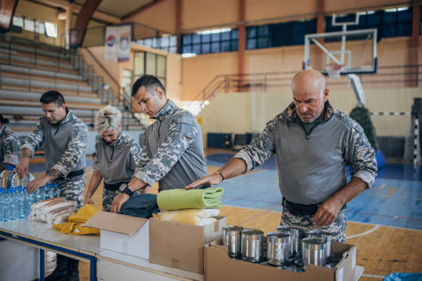 istock Soldiers preparing donations for civilians 1417756361
