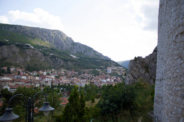 istock High shot big mountains and town buildings 1417756659