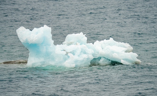 Antarctic iceberg landscape at Portal Point which is located at the entrance to Charlotte Bay on the Reclus Peninsula, on the west coast of Graham Land.