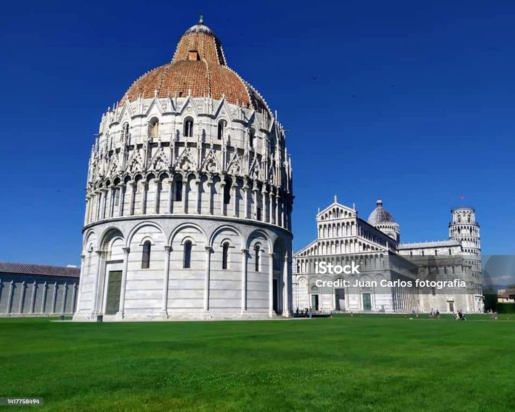 The Baptistery of Pisa, dedicated to St. John the Baptist, is opposite the cathedral at the western end of Piazza dei Miracoli, Pisa, Italy Ancient Stock Photo