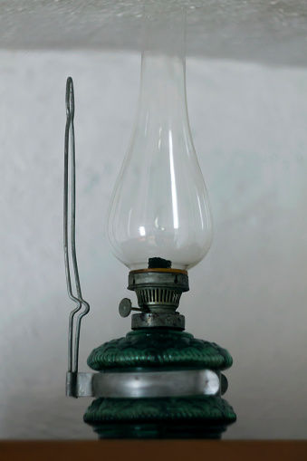 Vintage Yellow Rusted Lantern on Wooden Board