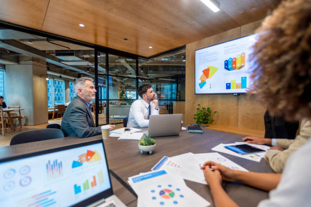 istock Big data presentation on a tv in a board room. 1417763488