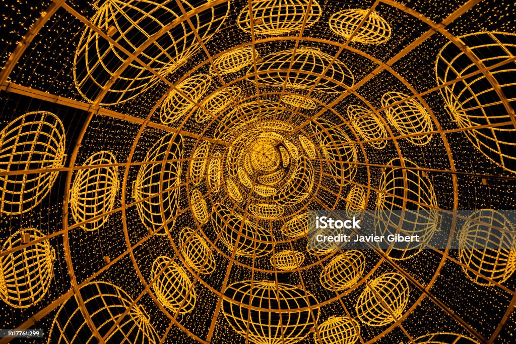 Christmas tree placed in Puerta del Sol captured from the inside The iconic christmas tree placed in Puerta del Sol captured from the inside. The decoration involves a pattern. This year was formed by the symbol of the National Lottery. Christmas Stock Photo