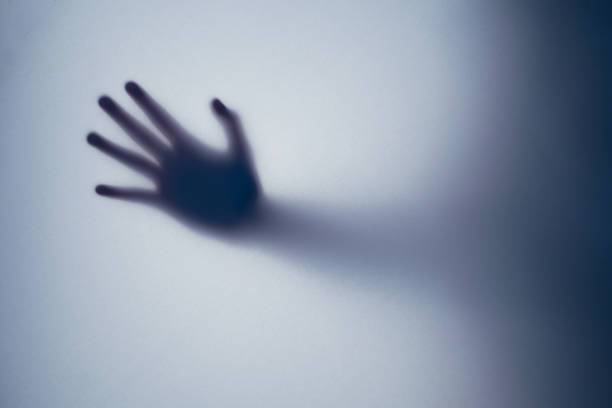 istock Right hand shadow blur behind frosted glass. 1417764527