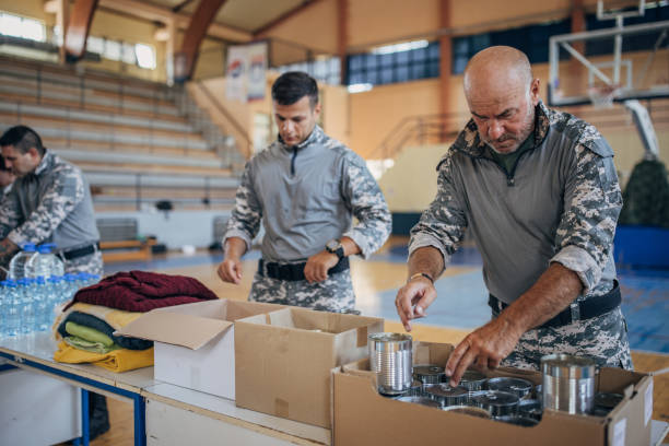 istock Soldiers preparing donations for civilians 1417766187