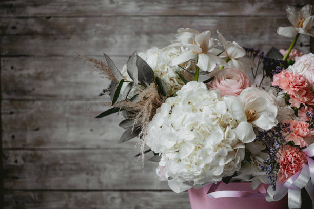 istock Beautiful flowers composition on wooden background 1417766537