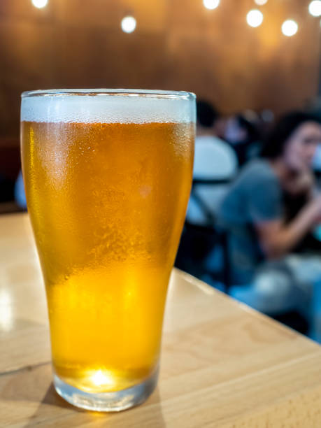 istock Glass of ice cold beer on a bar counter 1417771683