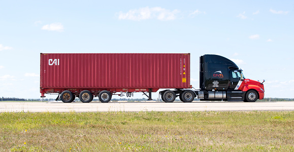 Calgary, Alberta, Canada. August 17, 2022. A truck hauling freight along the Queen Elizabeth II Highway