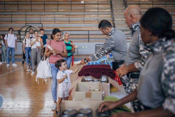 istock People receiving donations after natural disaster 1417785546