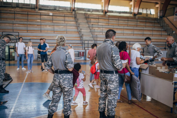 istock Civilians receiving donations after natural disaster 1417785641