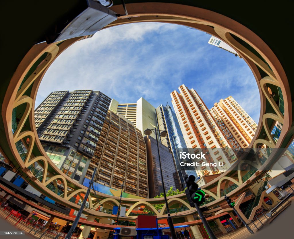 View of the building from under the footbridge at the junction of Yee Wo Street and Sugar Street. Old tenement buildings in Causeway Bay coexist with new buildings. Causeway Bay Stock Photo