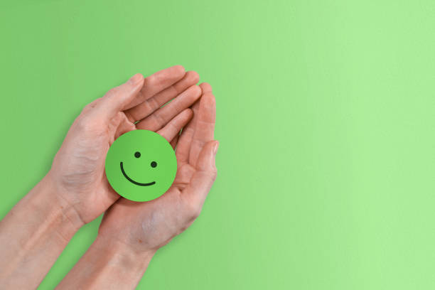 istock Positive Green Smiley Concept - Successful Paper Smiley Face with Copy Space 1417797159
