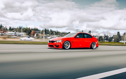 Seattle, WA, USA
8/12/2022
Red BMW M3 driving on the highway