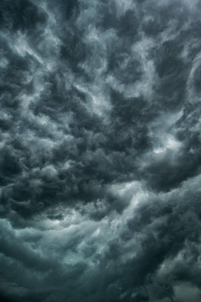 Dark swirling clouds roll in before a thunderstorm stock photo