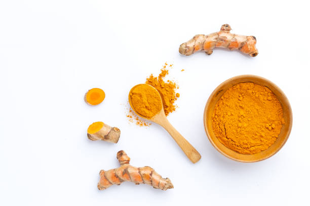 istock Turmeric powder and turmeric root isolated on white background ,Top view 1417804002