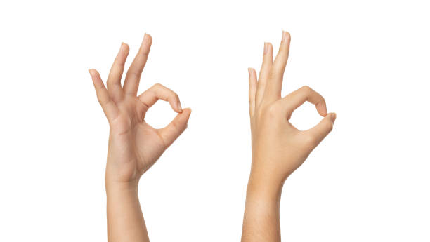 Woman hand ok sign on a white isolated background with clipping path Woman hand ok sign on a white isolated background with clipping path hand ok sign stock pictures, royalty-free photos & images