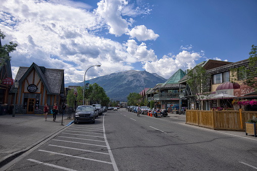 Jasper, Alberta, Canada - July 30, 2022: Street view of famous Jasper town center on a sunny afternoon.