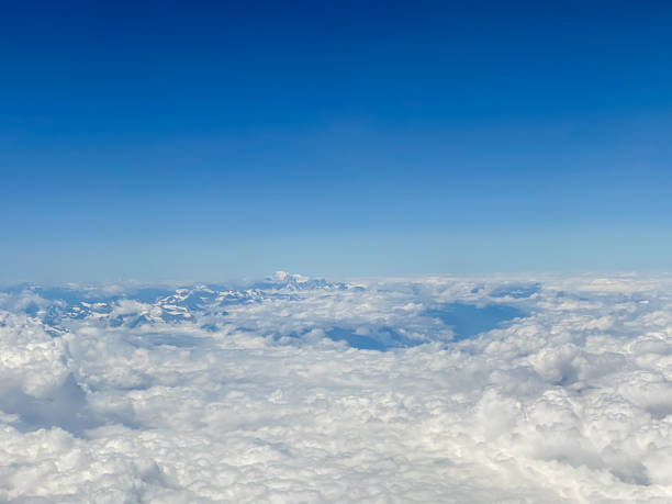 Aerial views of the Swiss Alps en route to Milan Aerial views of the Swiss Alps en route to Milan stratosphere airplane cloudscape mountain stock pictures, royalty-free photos & images