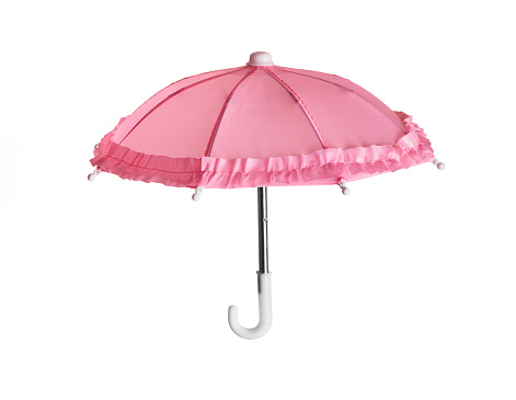 Pink toy romantic umbrella with ruffles isolated on white background.