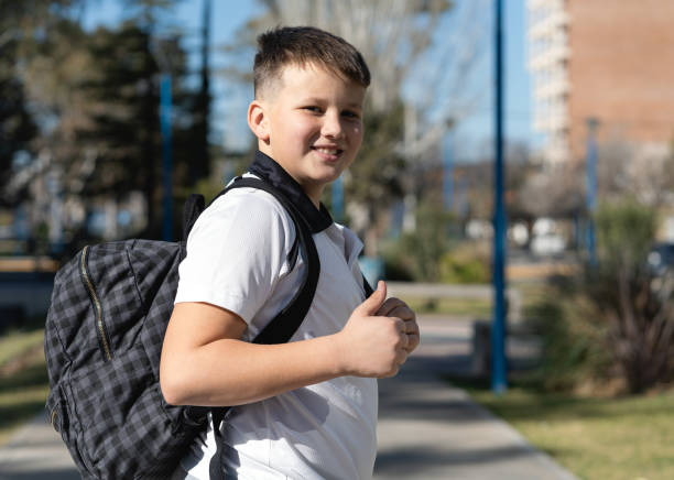 istock Kid looking at the camera and smiling with thumb up. Back to school concept 1417824793
