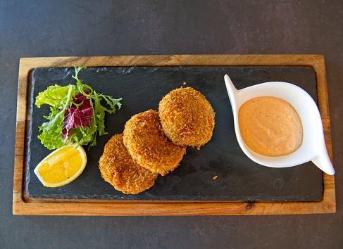 Fritters filled with lobster and shrimp meat served with paprika mayonnaise and salad.