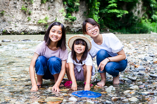 Three girls having fun at the river