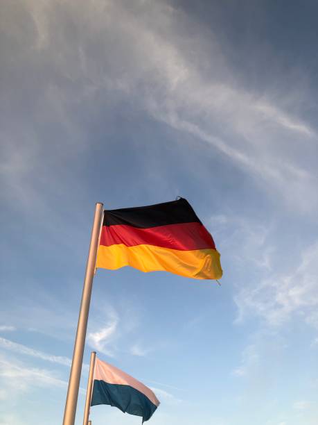 istock Germany flag with Bavarian flag in the evening sky 1417834320