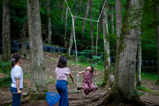 Three kids on summer vacation in nature