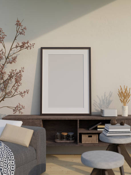 istock White empty frame mockup is on a minimal dark wood cabinet over the white wall. home living room 1417838647
