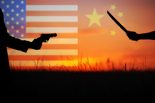 Katana versus revolver fight in the field. Military conflict in Asia. Battle of the big countries. USA, Taiwan vs China in World political war concept.