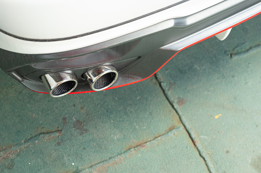 Car exhaust pipe with sport design. Vehicle modify part object photo.