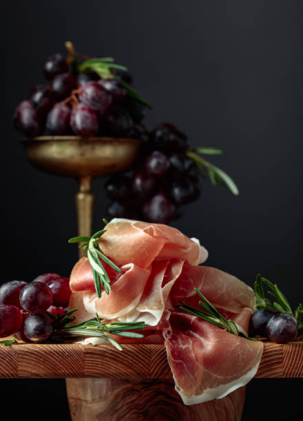 Prosciutto with grapes and rosemary.
