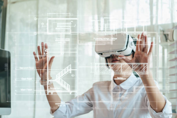 Asian woman Architect or Engineer wearing VR headset for hologram blueprint detail working with BIM technology. Asian woman Architect or Engineer wearing VR headset for hologram blueprint detail working with BIM technology. Concept futuristic construction design. Selective focus. building information modeling photos stock pictures, royalty-free photos & images