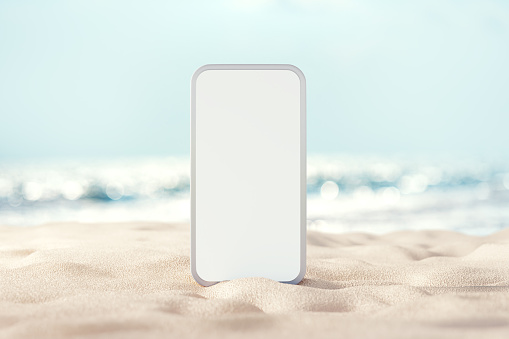 istock Background blank mobile phone on sand beach, Space for promotion of summer. 1417847488