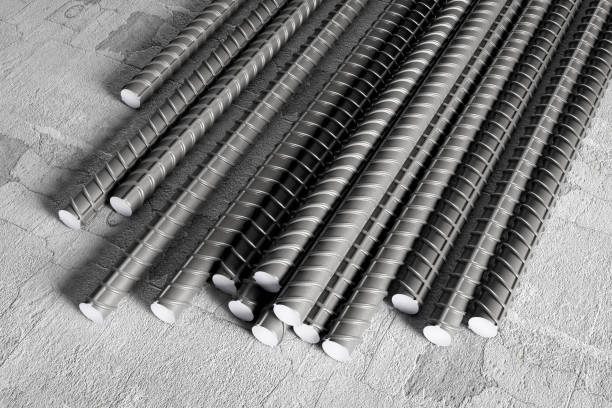 Metal reinforcement for construction and production. Metal reinforcement for the basement of building against the background of concrete. rebar production stock pictures, royalty-free photos & images