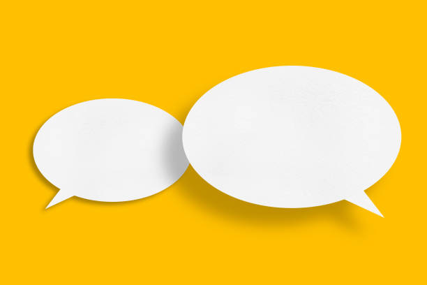 istock White paper in speech bubble shape set against yellow background. 1417848854