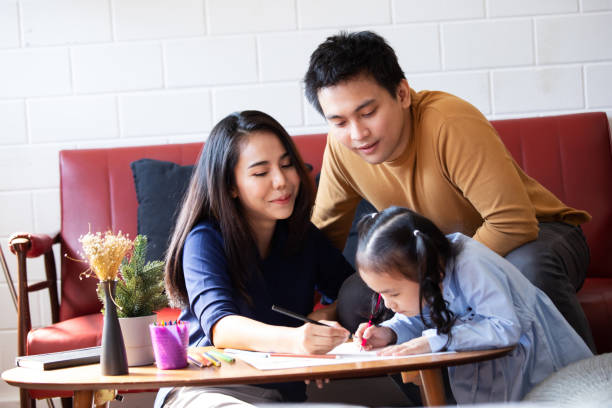 istock parents teaching children to do homework 1417848995
