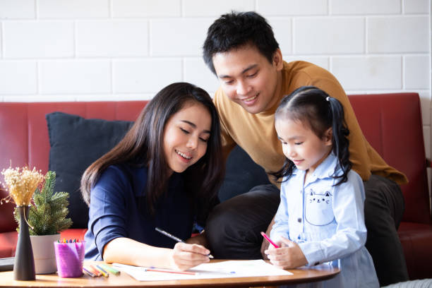 istock parents teaching children to do homework 1417849007