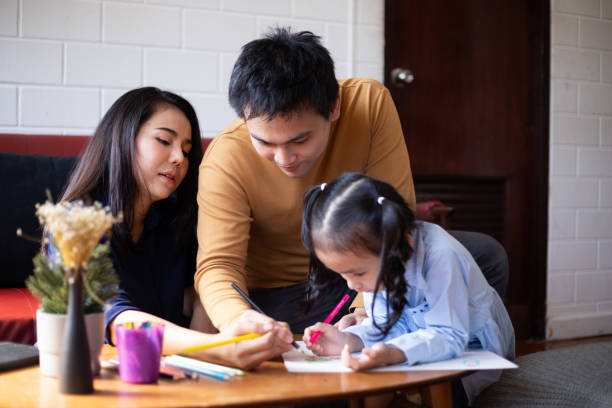 istock parents teaching children to do homework 1417849012