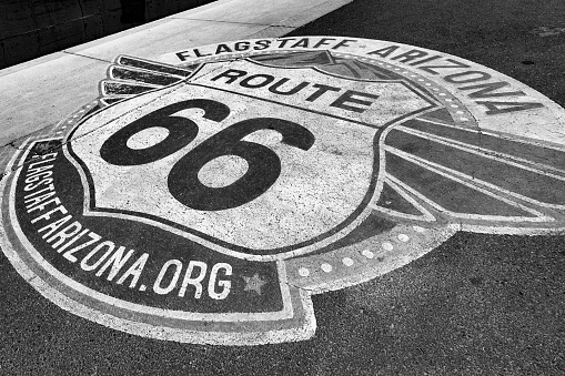 Flagstaff, USA - May 26, 2022: symbol of route 66 at the bitumen in Flagstaff.