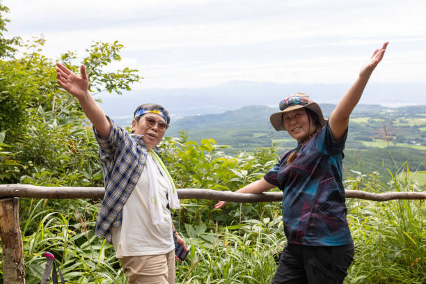 istock Female mountain hiker friends stop for a break 1417852399