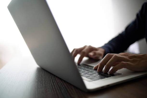 istock Person are using laptops, working or studying online at home. businessman using laptop work outside the office 1417857868